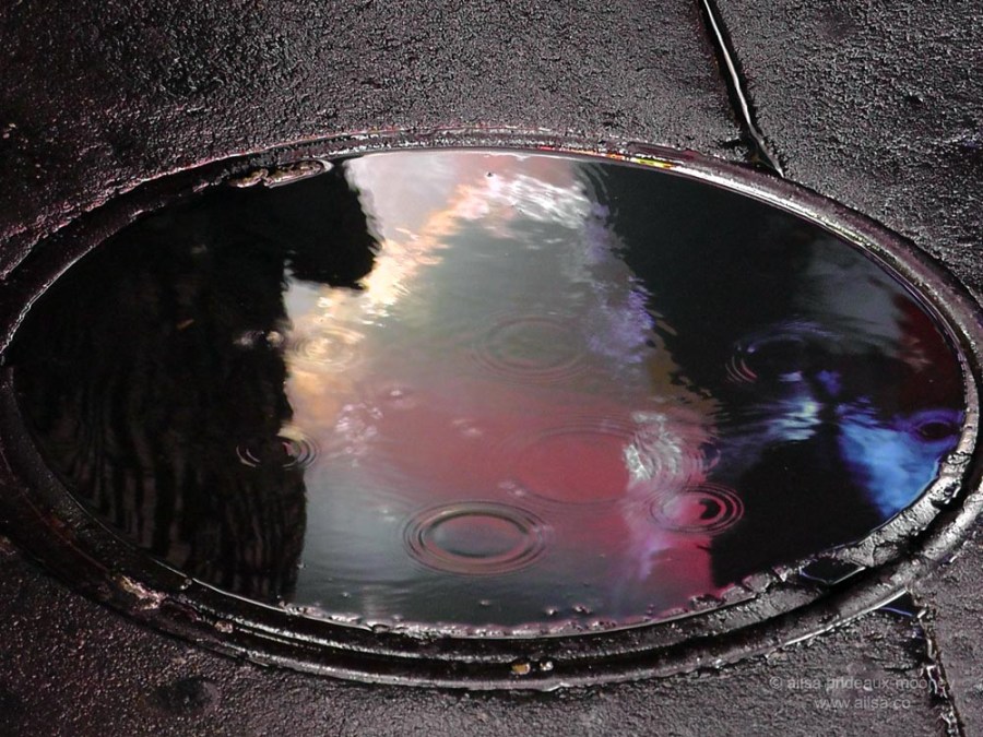 rain water manhole cover new york america us usa reflection neon